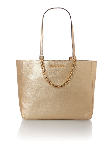 michael kors gold tote handbags.